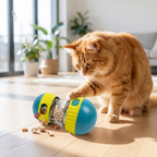 Cat pawing at treat dispenser toy
