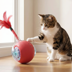 Cat touching rolling feather ball toy with paw